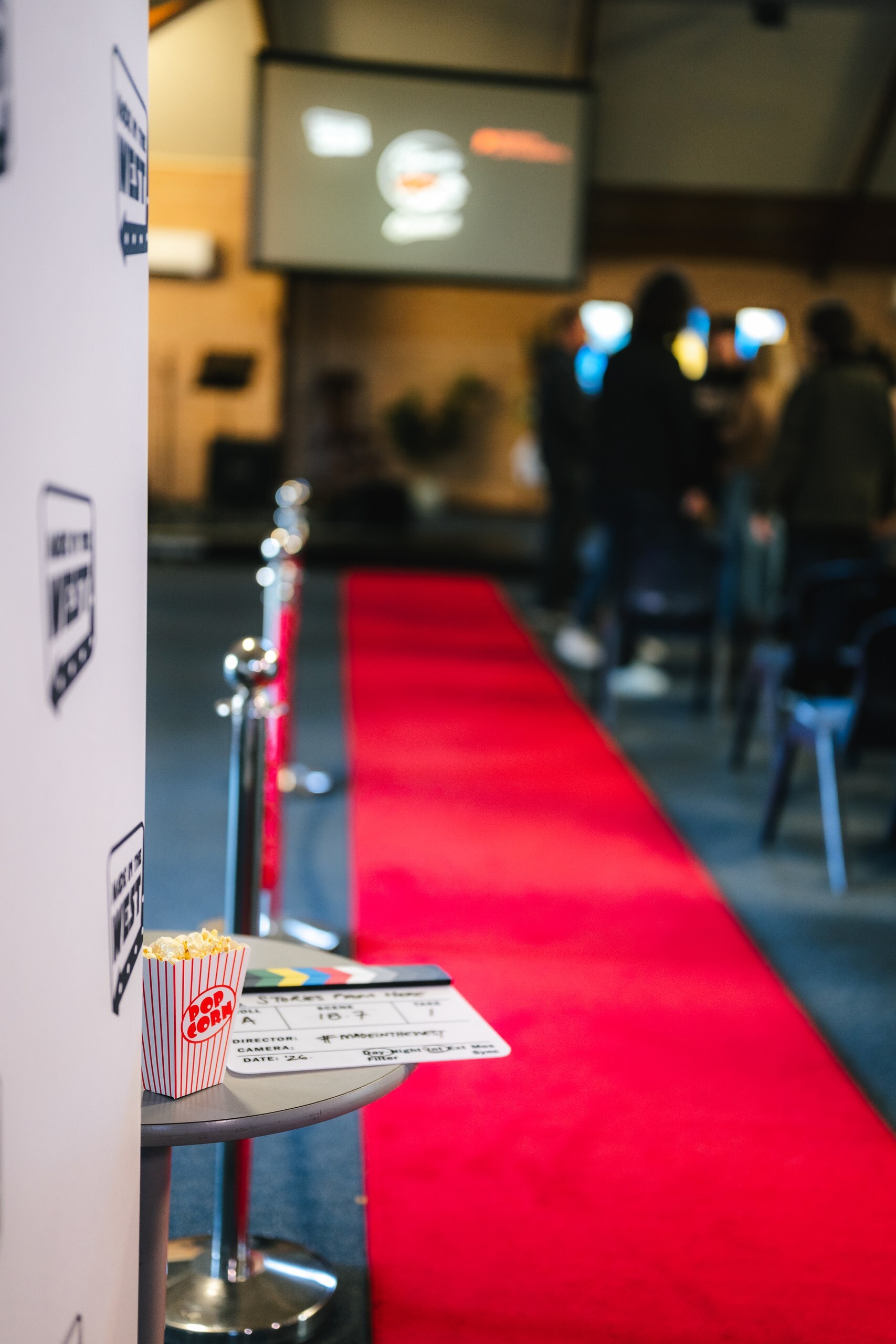 Red carpet leading to a screen