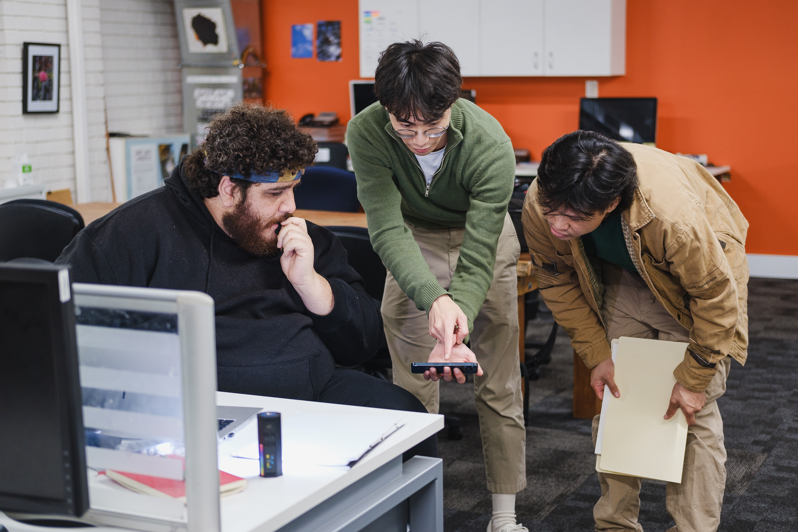 Three artists collaborating on a film